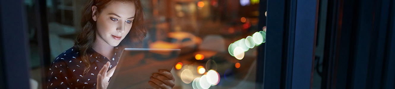 Lady in window on a mobile device